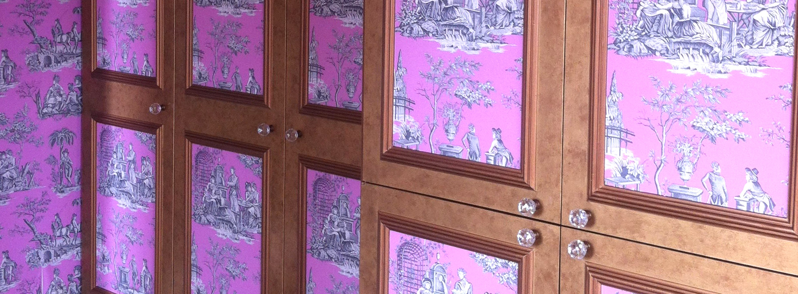 Broken colour metallic finish wardrobes with wallpaper inlay